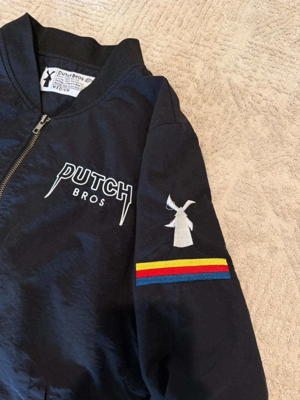 Dutch Bros Black Bomber Jacket with Multicolor Sleeve Stripe - Picture 2 of 3